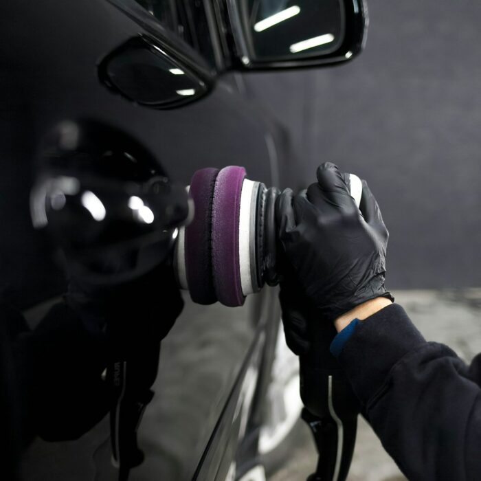 worker-of-the-detailing-center-polishes-car-body.jpg